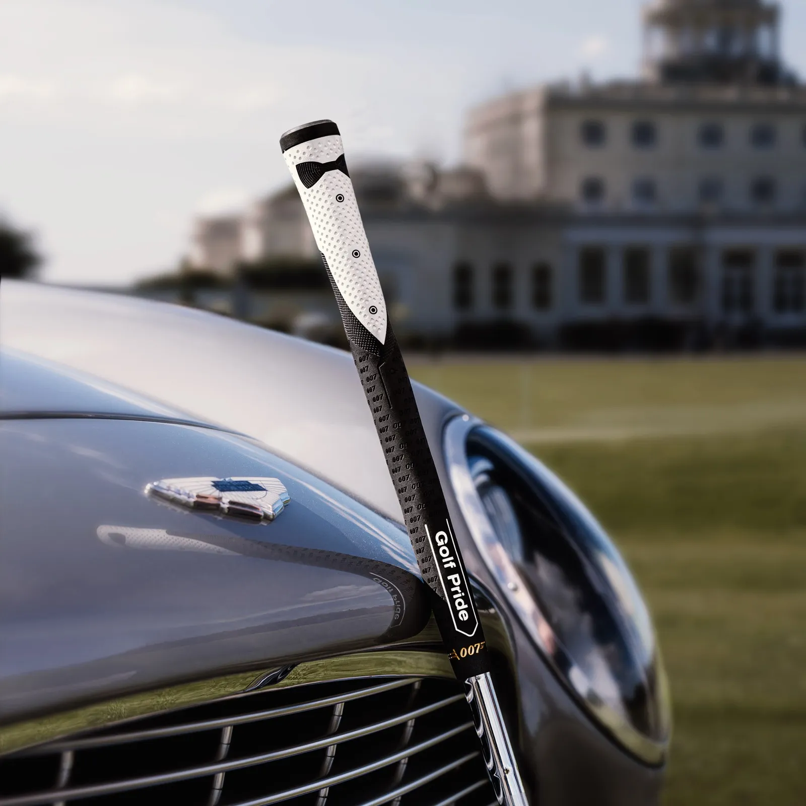 Golf Pride 007 grip resting on Aston Martin DB5 at Stoke Park