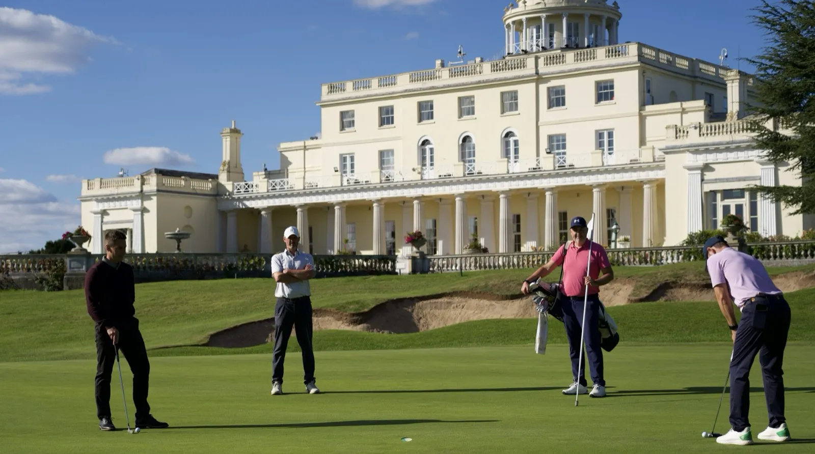 Golfers on the green at Stoke Park